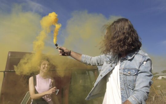 playing-with-a-yellow-smoke-bomb